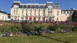 A large hotel building with the name "Grand Hotel" prominently displayed.