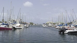 Stunning marina views with sailboats and yachts anchored in calm waters.