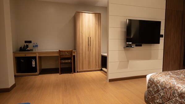 Superior Room | Living area | 36-inch LED TV with premium channels, TV - The Cindrella Hotel (Jalpaiguri)