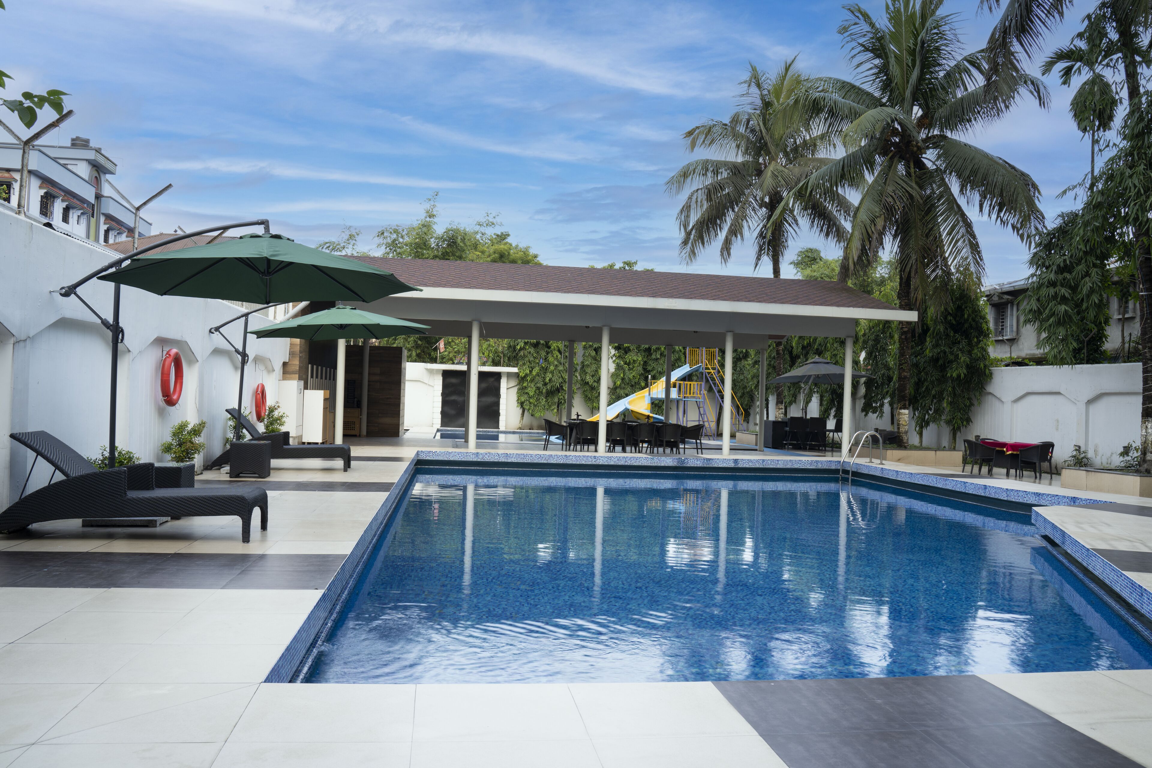 2 outdoor pools, open 6 AM to 8 PM, pool umbrellas, pool loungers