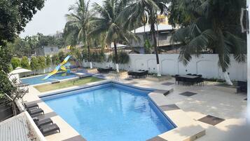 2 outdoor pools, open 6 AM to 8 PM, pool umbrellas, pool loungers