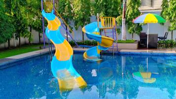 2 outdoor pools, open 6 AM to 8 PM, pool umbrellas, pool loungers