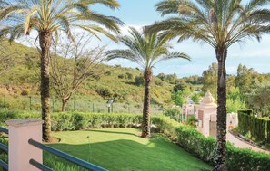 Surrounded by lush vegetation and a serene lawn, this tranquil oasis offers a peaceful escape.