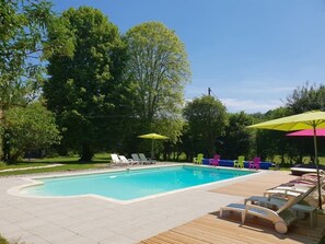 Seasonal outdoor pool, open 10:00 AM to 7:30 PM, pool umbrellas