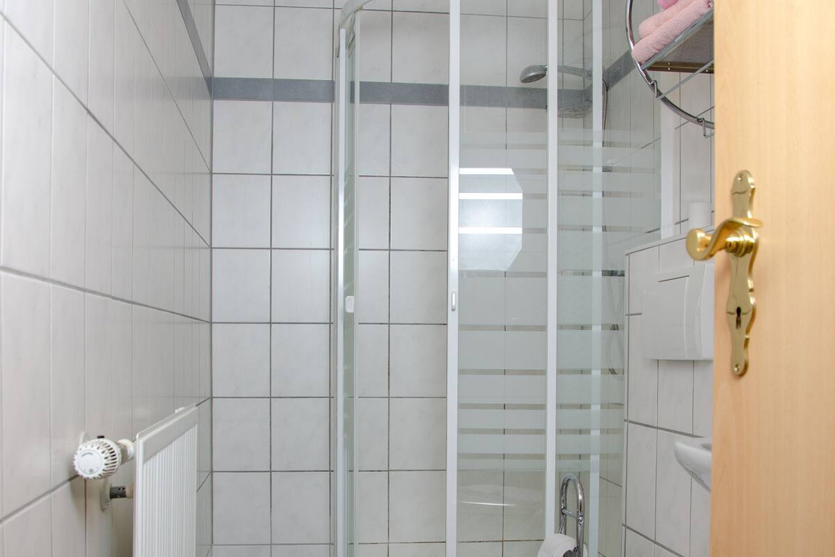 suite | bathroom | shower, hair dryer, towels