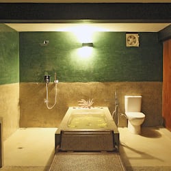 Deluxe Suite | Bathroom | Designer toiletries, hair dryer, bathrobes, slippers