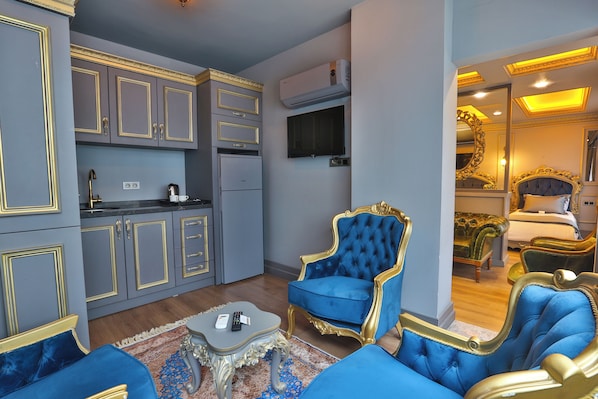 Luxury Apartment | Private kitchen | Full-size fridge, electric kettle, cleaning supplies, paper towels