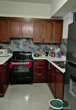 Basic House, 1 Queen Bed | Private kitchen | Full-sized fridge, microwave, oven, stovetop