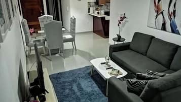 Basic House, 1 Queen Bed | Living area | Flat-screen TV