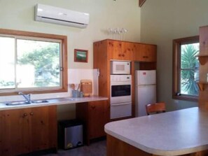 Fridge, microwave, oven, stovetop - **Bournda Beach Cottage** (Tura Beach)
