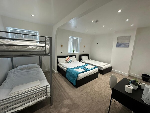 Family Quadruple Room, Multiple Beds, Ensuite | Individually decorated, individually furnished, free WiFi, bed sheets