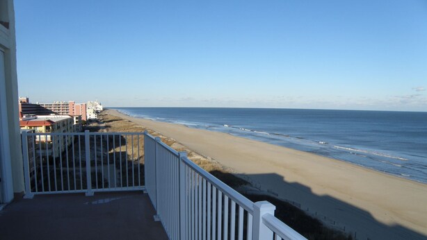 A balcony with a view of the beach and ocean. - Calypso unit 701 located at 62nd street and Ocean front (Ocean City)