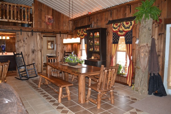 Dining Room featuring new aspen log furniture and heated floors