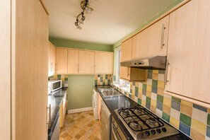 Microwave, dishwasher, cookware/dishes/utensils