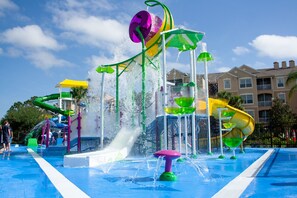 A water park with multiple slides and water features. - Pawnall Bliss | 4BR Cozy Home w/ Private Pool, Game Room, and Themed Kids' Room Near Disney (Kissimmee)