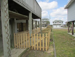 Residents enjoy a deck with a garden view.