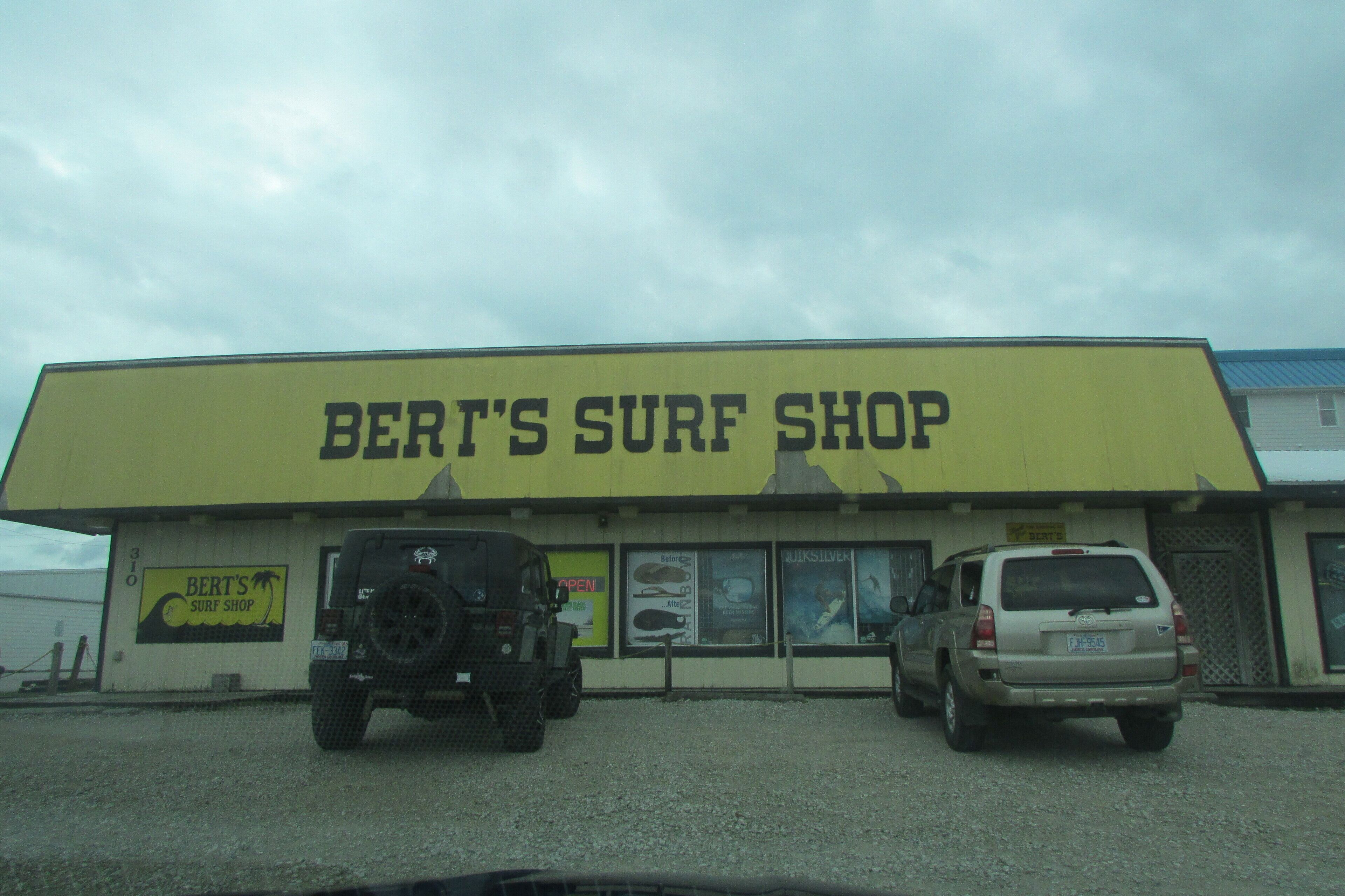 A building with a sign reading "BERT'S SURF SHOP".