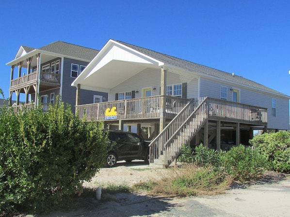 Stunning two-story residence with a spacious balcony and covered front porch.