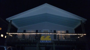 Welcome to Seablings, a charming two-story building with a spacious balcony and gabled roof.