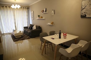 Classic Room, 2 Bedrooms | Living room | Flat-screen TV