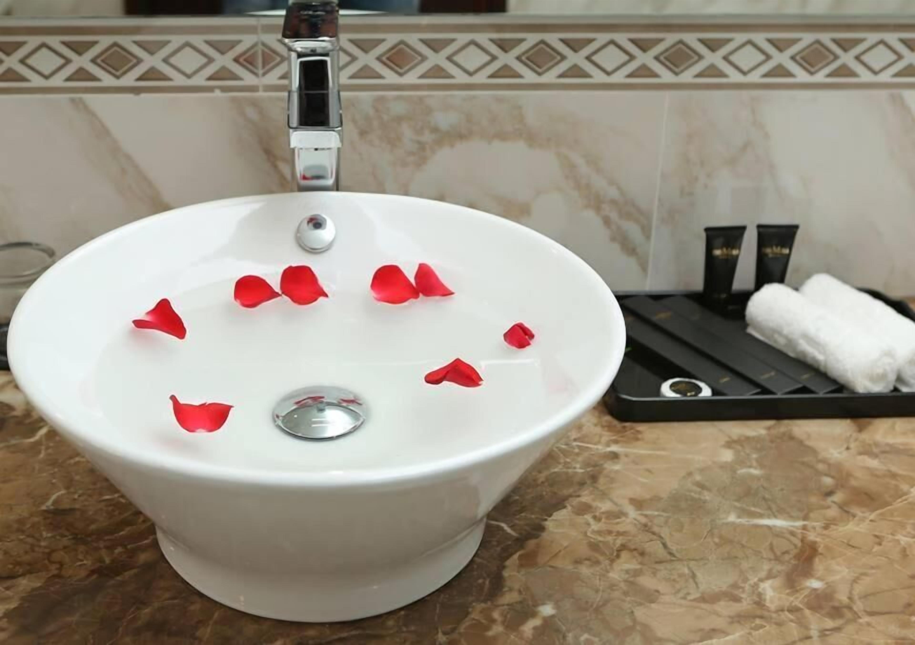 free toiletries, hair dryer, slippers, towels