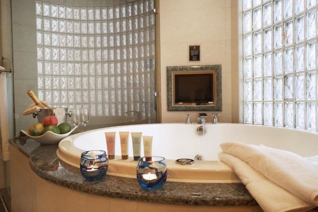 honeymoon suite | bathroom | hair dryer, slippers, bidet, towels