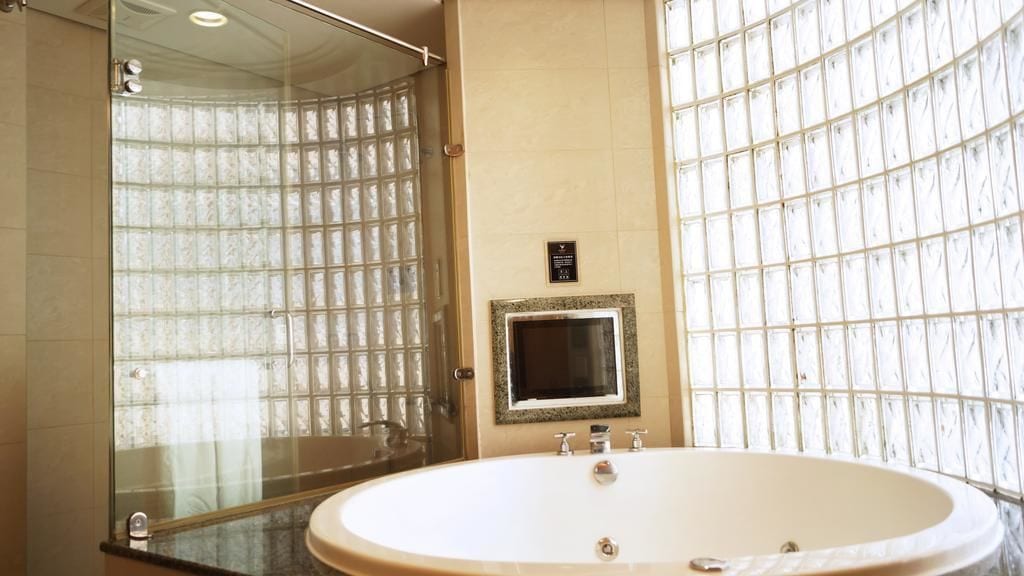 honeymoon suite | bathroom | hair dryer, slippers, bidet, towels