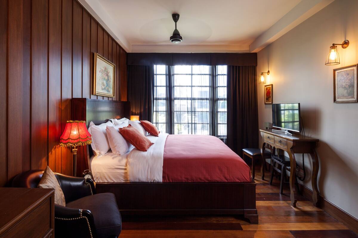 Junior Double Room | Minibar, in-room safe, blackout curtains, iron/ironing board