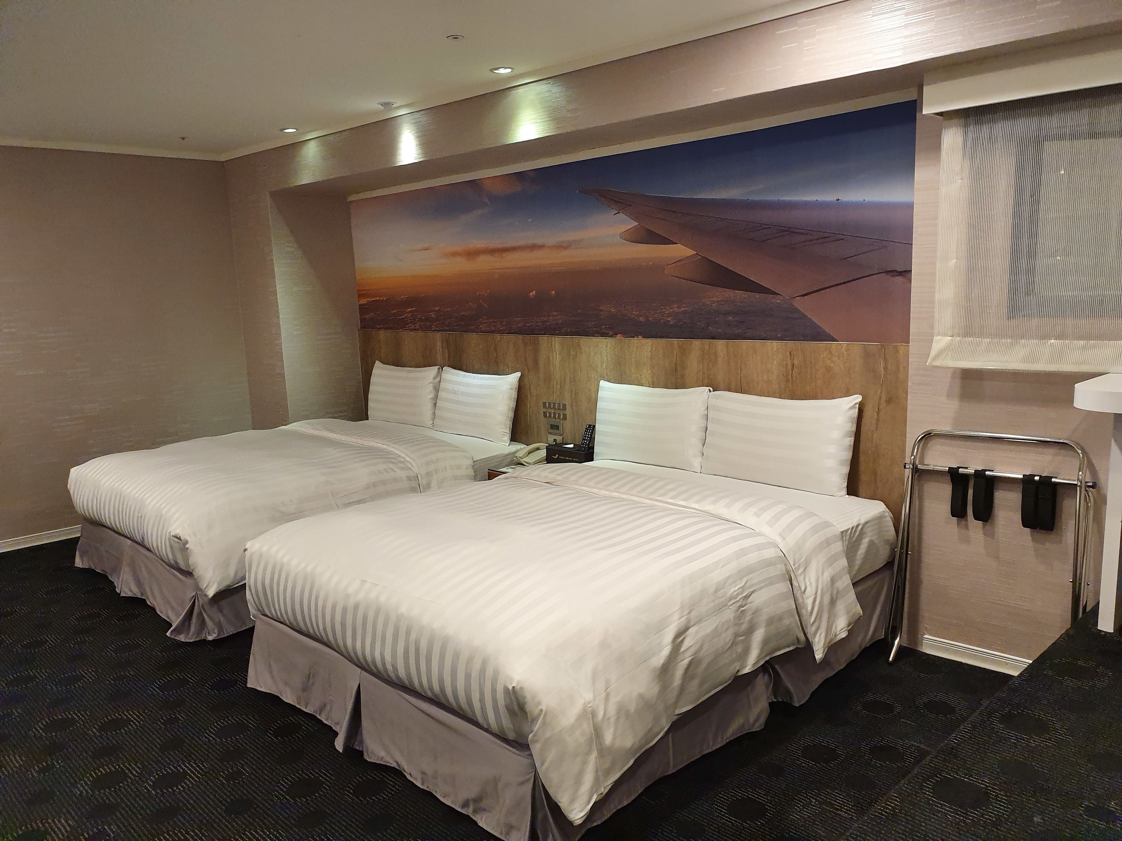 deluxe quadruple room, 2 double beds, tower | down duvets, in-room safe, desk, blackout curtains