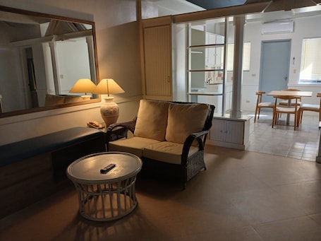 Basic Condo, 2 Bedrooms | Living room | Flat-screen TV