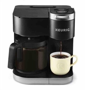 A Keurig coffee maker with a cup of coffee. - 🌴Surfside Paradise#3-amazing views,golfcart🌴 (Surfside Beach)