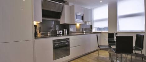 Apartment, 1 Bedroom | Private kitchen | Fridge, microwave, stovetop, dishwasher