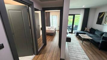 Superior Suite, Partial Sea View | Minibar, in-room safe, desk, free cribs/infant beds