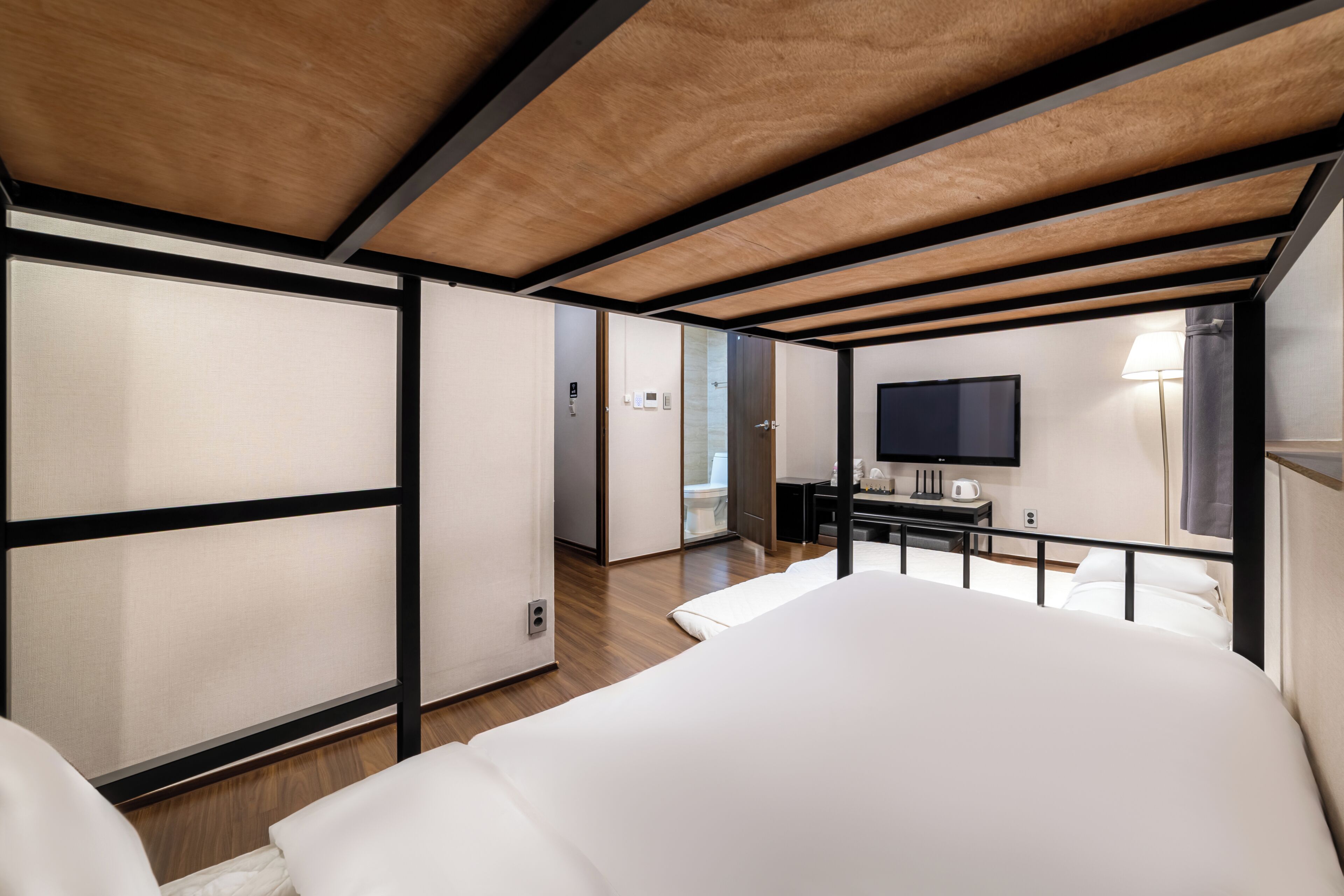 Family Room | Premium bedding, desk, blackout drapes, iron/ironing board