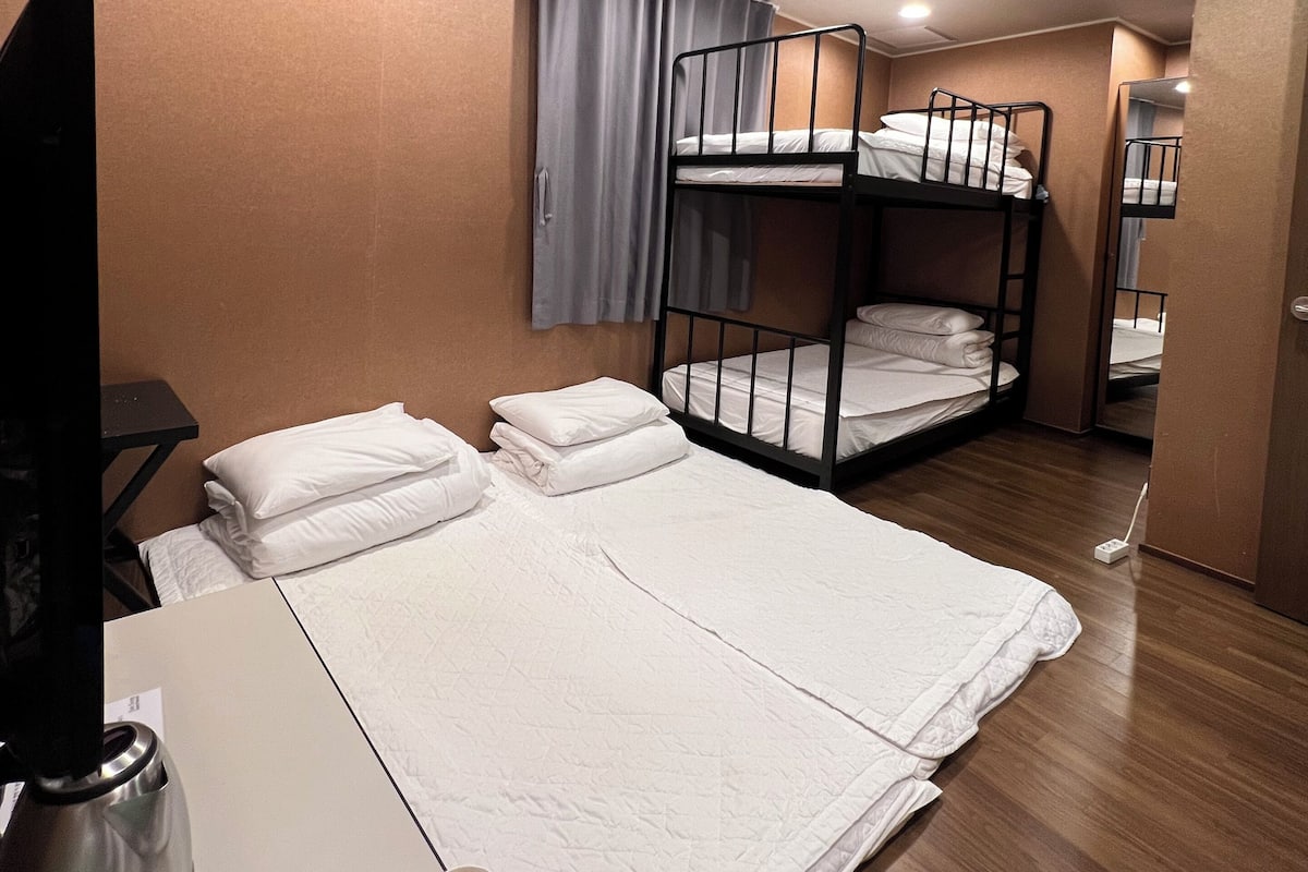 Family Room | Premium bedding, desk, blackout drapes, iron/ironing board