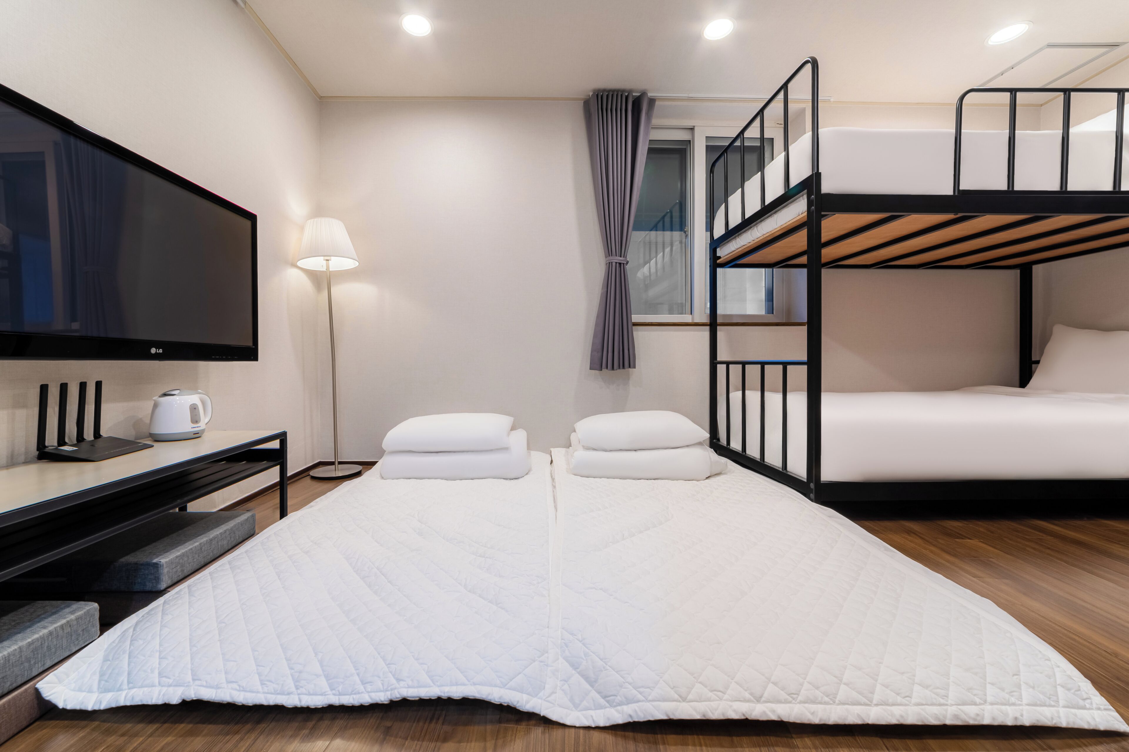 Family Room | Premium bedding, desk, blackout curtains, iron/ironing board