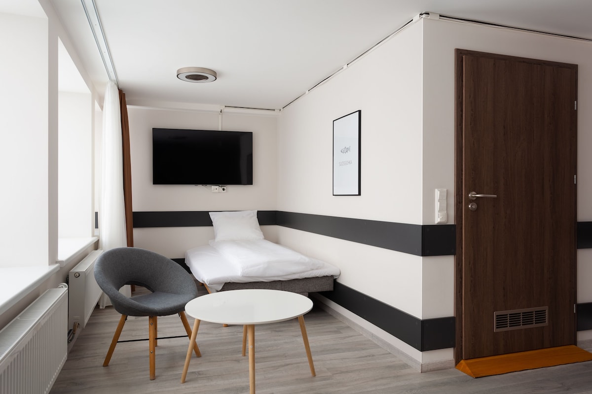 Blackout drapes, soundproofing, iron/ironing board (on request)