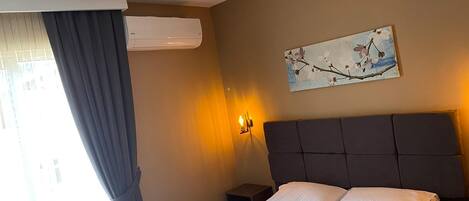 Habitación estándar | Sábanas de algodón egipcio, ropa de cama de alta calidad y minibar