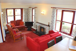 Bungalow, 2 Bedrooms (Eilrig) | Living room | Flat-screen TV, DVD player - Cairngorm Highland Bungalows (Aviemore)