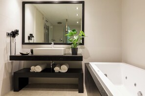 Bathtub, jetted bath, hair dryer, towels