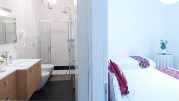 Deluxe Triple Room, Private Bathroom | In-room safe, desk, blackout drapes, soundproofing