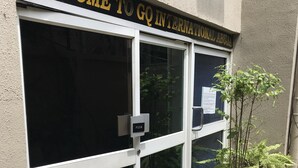 A building entrance with a sign reading "WELCOME TO GO INTERNATIONAL ABUJA". - GQ International Hotel (Abuja)