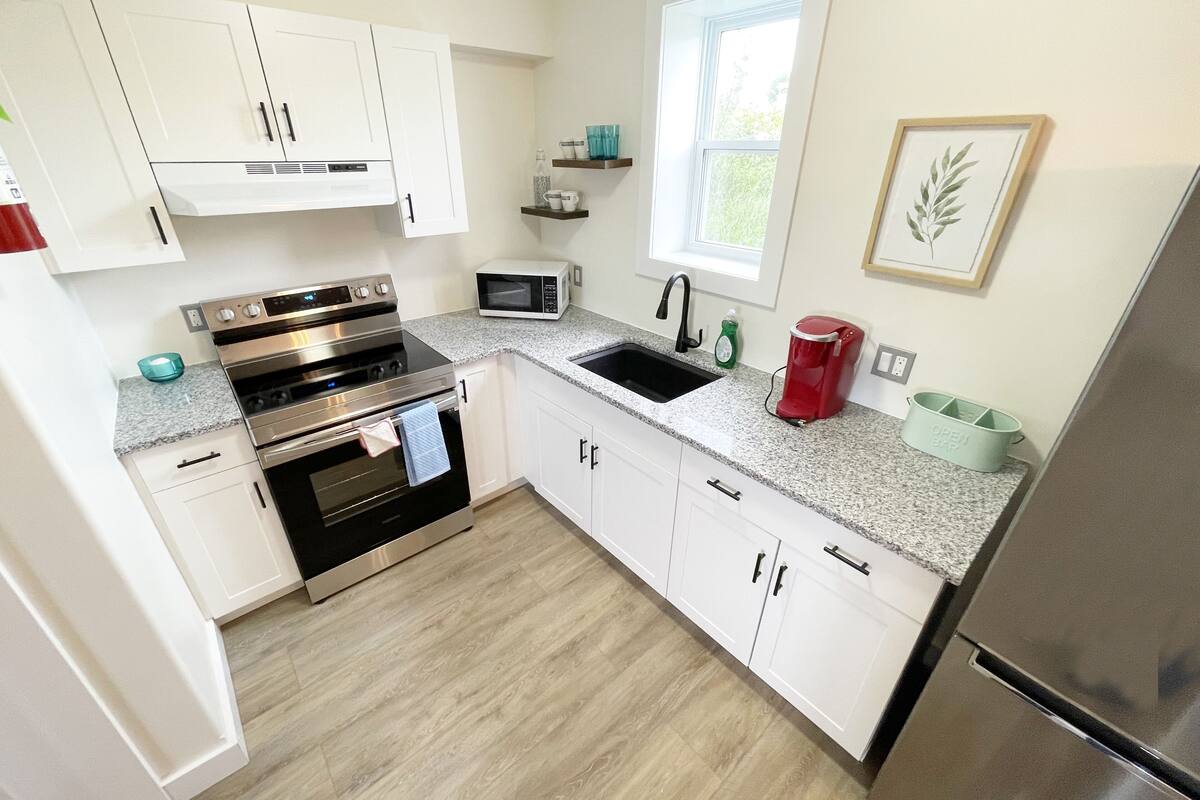 design suite, 2 bedrooms, kitchen, bay view | private kitchen | full-sized fridge, coffee/tea maker, electric kettle, coffee grinder