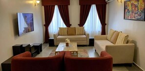 Grand Apartment, 3 Bedrooms | Living area - Tenny's Place Apartments (Abuja)