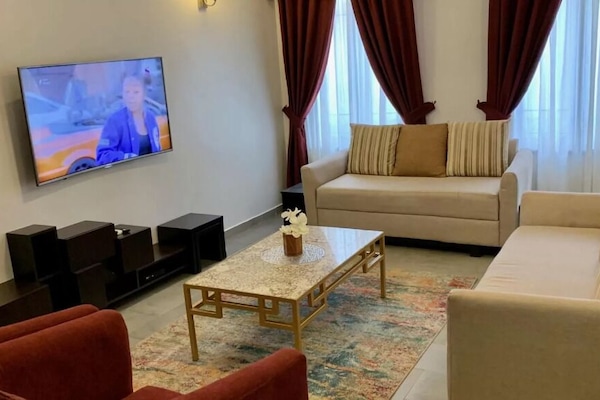 Grand Apartment, 3 Bedrooms | Living area | Flat-screen TV