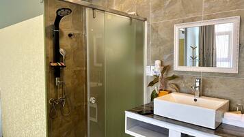 Combined shower/tub, free toiletries, hair dryer, slippers
