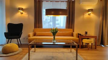 Superior Apartment, 1 Bedroom, Balcony | Living area | Flat-screen TV