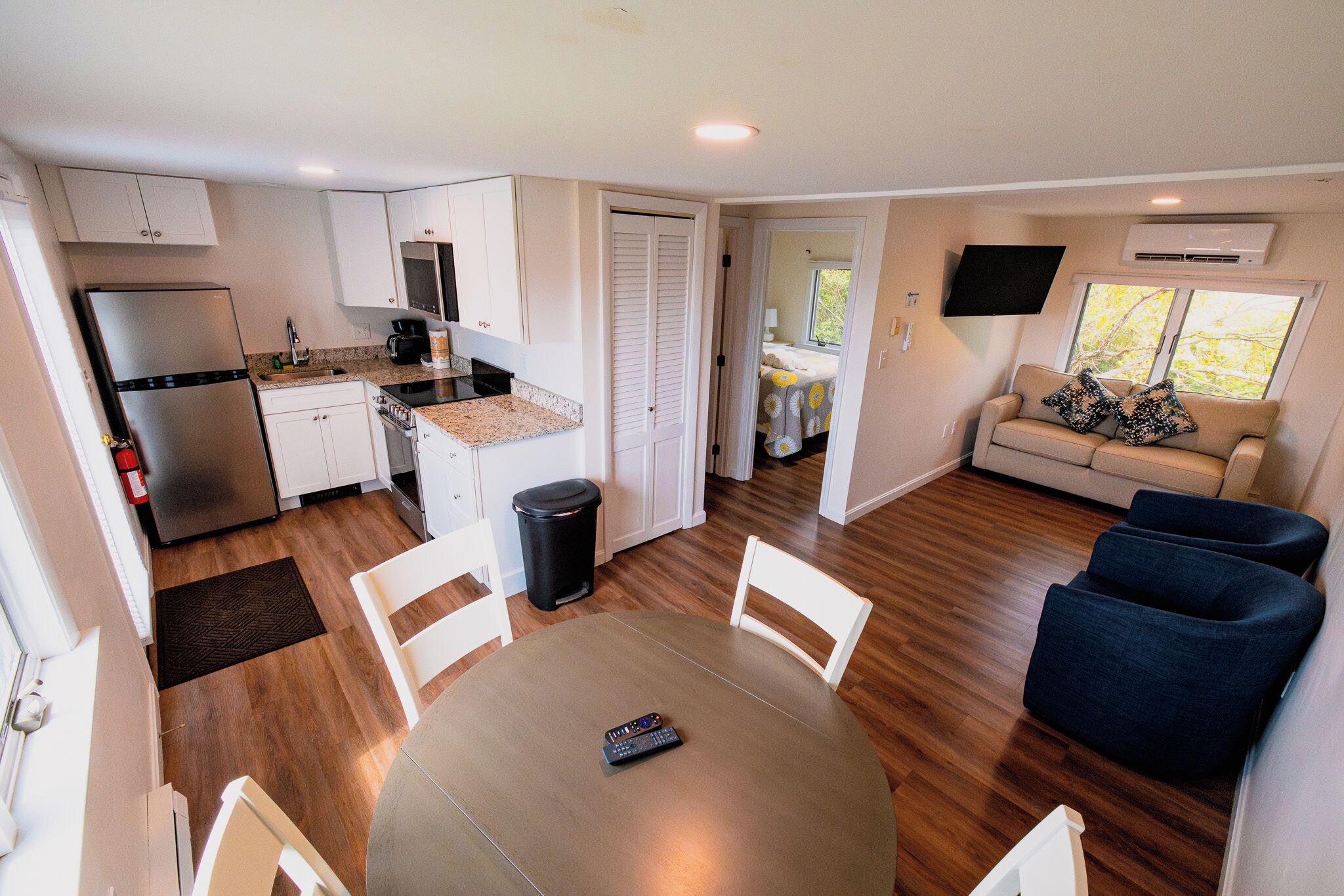 A compact living space with a kitchen, dining area, and seating area.