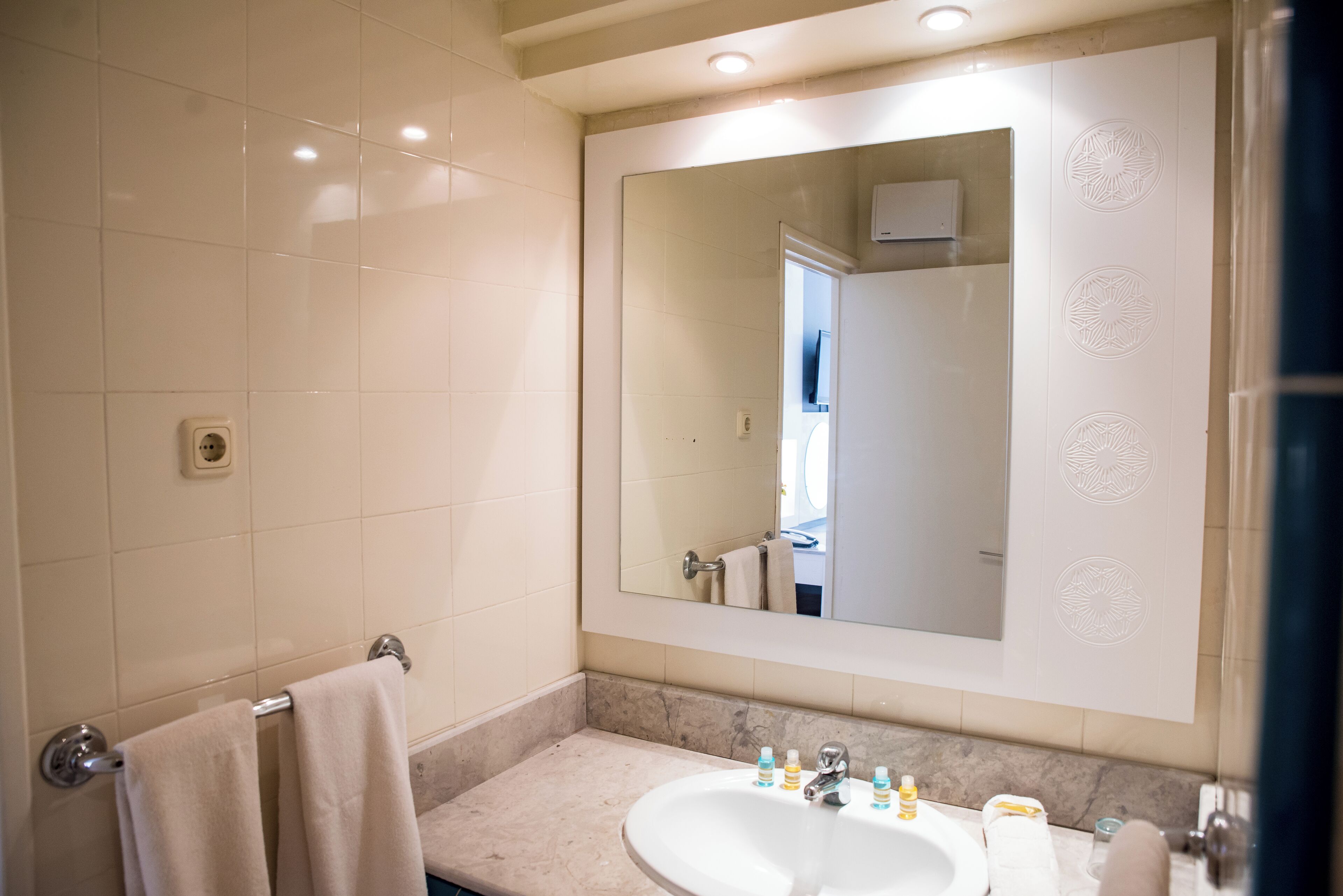 deep-soaking bathtub, rainfall showerhead, free toiletries, hair dryer