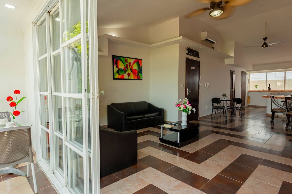 Family Apartment | Living area | 50-inch flat-screen TV with cable channels, TV, Netflix